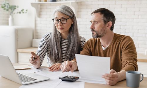 Two people using a computer